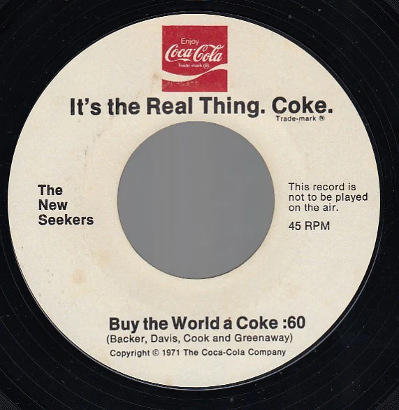 The New Seekers - It's The Real Thing. Coke. (7", Styrene, All) (Very Good (VG))